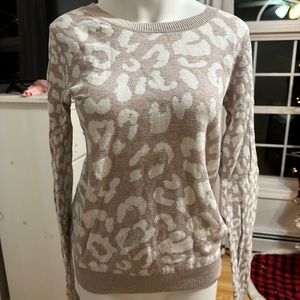 Women’s Express beige and white leopard print sweater.